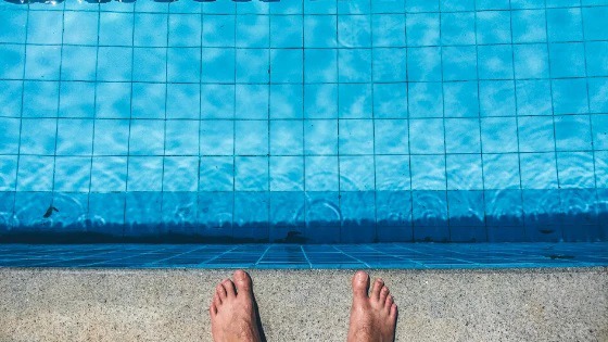 Why should you wear swimming earplugs?